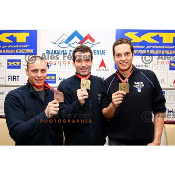 Emil Tahirovic (left), Peter Mankoc, Matjaz Markic (right) with medals from European Swimming Championship in 25 meters pool at press conference in Hala Tivoli, Ljubljana 15.12.2008 