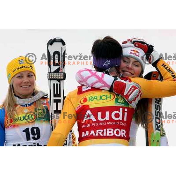 sixth placed Frida Hnasdotter (SWE), winner Maria Riesch (GER) and fourth placed Lindsay Vonn (USA) at podium of Audi FIS Ski world Cup slalom at 45.Golden fox- Zlata Lisica , Maribor, Slovenia 11.1.2009 