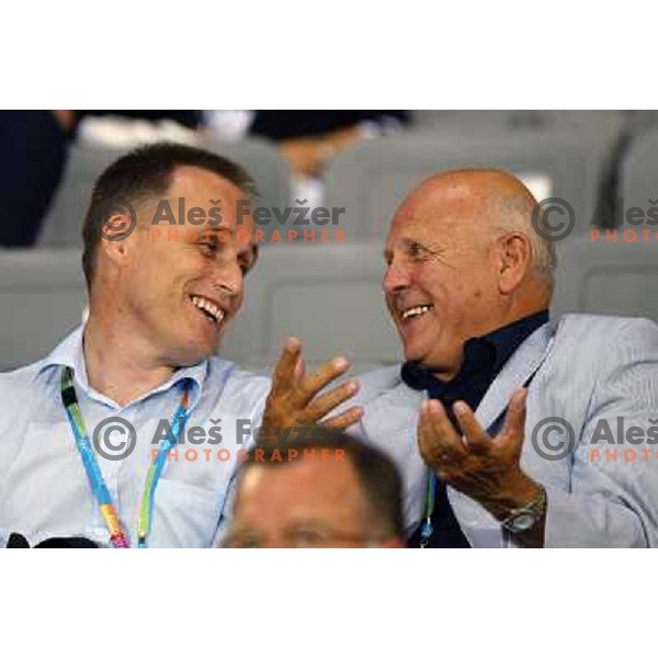 Slavko Gaber (left) and Janez Kocijancic watching Jolanda Ceplak (SLO) winning bronze medal at 800 meters at Olympic games Athens 2004 
