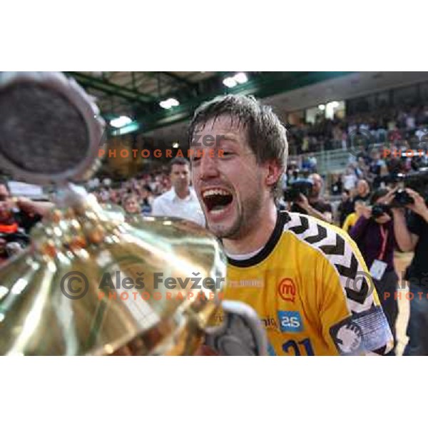 Uros Rapotec and RK Cimos Koper players celebrate at handball match Rk Cimos Koper- RK Celje Pivovarna Lasko in Final of Slovenian Cup, played in Bonifika Hall in Koper 19.4.2009. RK Cimos Koper won 24:19 and won the Cup 