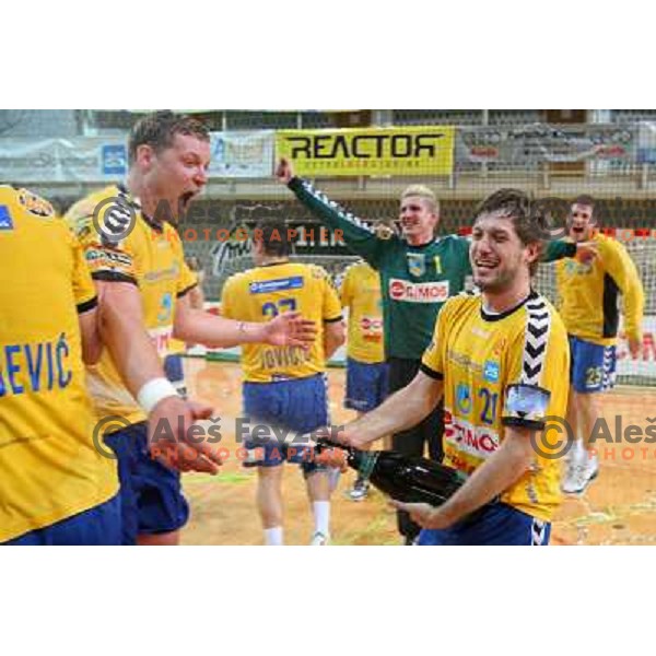 Uros Rapotec,Rok Praznik and RK Cimos Koper players celebrate at handball match Rk Cimos Koper- RK Celje Pivovarna Lasko in Final of Slovenian Cup, played in Bonifika Hall in Koper 19.4.2009. RK Cimos Koper won 24:19 and won the Cup 
