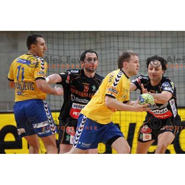Nejc Poklar of Cimos Koper and Toskic, Bedekovic at handball match Cimos Koper- Celje Pivovarna Lasko in the final of Slovenian Cup, played in Bonifika hall, Koper 19.4.2009. Cimos Koper won 24:19 