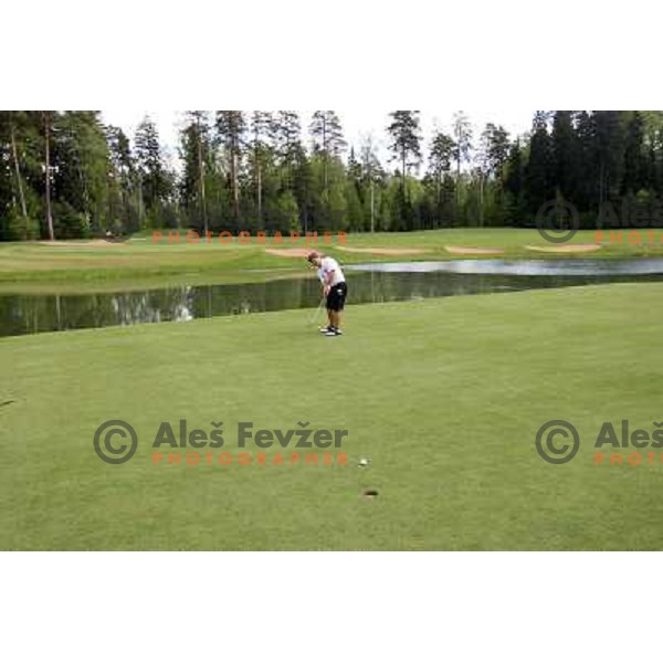 Ilya Grazdiyanu, Russian national amatuer golf team member sinking a birdie on hole nr.13 (390 meters, par 4) at Le Meridien Moscow country club ( 6542 meters, par 72) on Wednesday 20.5.2009 