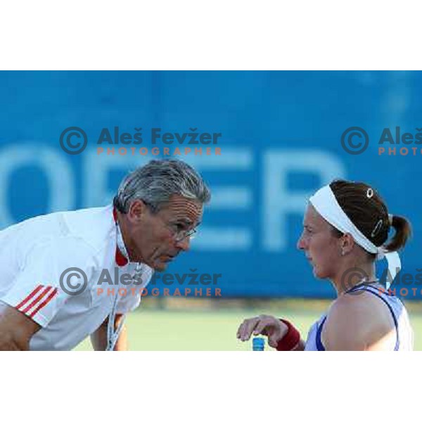 Coach talks to Kristina Barrois (GER) in action during match in first round of Banka Koper Slovenia Open WTA tour tennis tournament in Portoroz, Slovenia 20.7.2009 