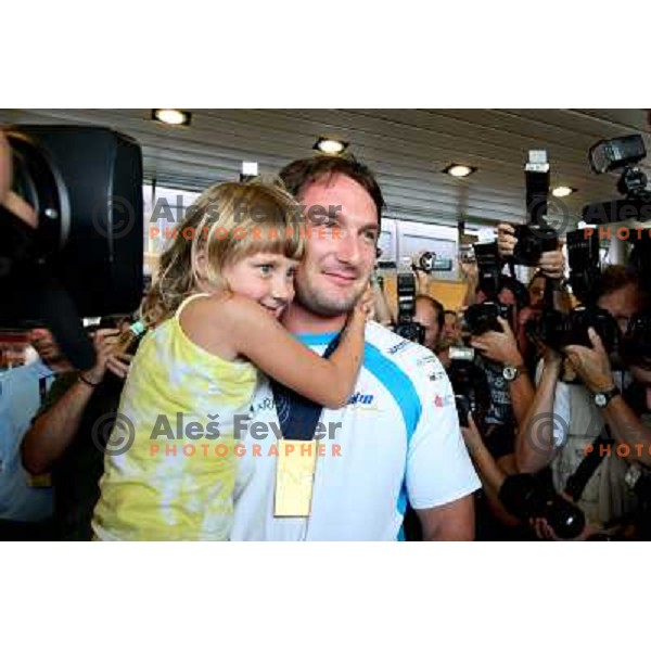  Primoz Kozmus, gold medalist in hammer throw from Athletics World Championships in Berlin during reception at Airport Joze Pucnik, Brnik, Slovenia 19.8.2009 posing with a fan 