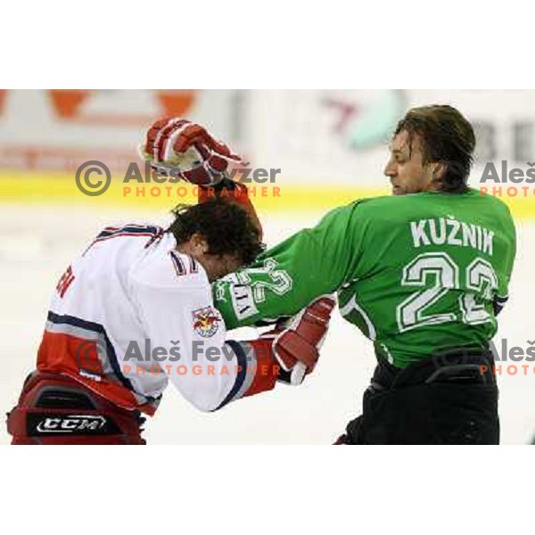 Michael Gergen (17) and Greg Kuznik (22) in fight action during ice-hockey match Tilia Olimpija-Red Bull Salzburg in Ebel league, played in Hala Tivoli, Ljubljana, Slovenia 1.10.2009 