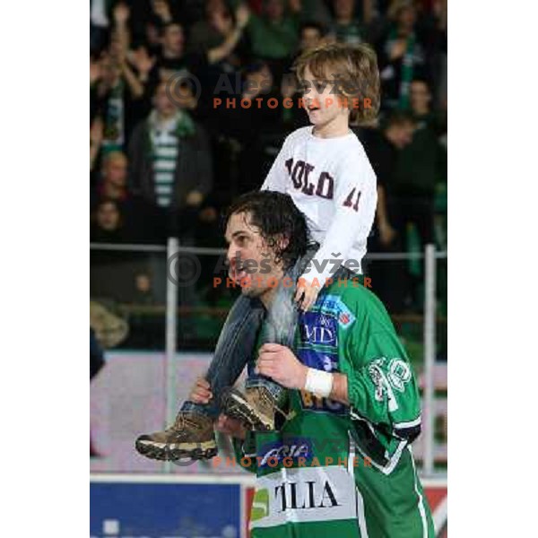 Frank Banham with Ivo Jan\'s son Lan celebrate victory after ice-hockey match Tilia Olimpija- Acroni Jesenice in Ebel league, played in Hala Tivoli, Ljubljana, Slovenia 27.11.2009. 