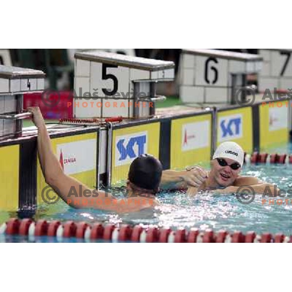 Peter Mankoc (SLO) and Evgeny Korotyshkin (RUS) after action during swimming competition Ilirija Challenge in Tivoli pool, Ljubljana, Slovenia 16.12.2009 