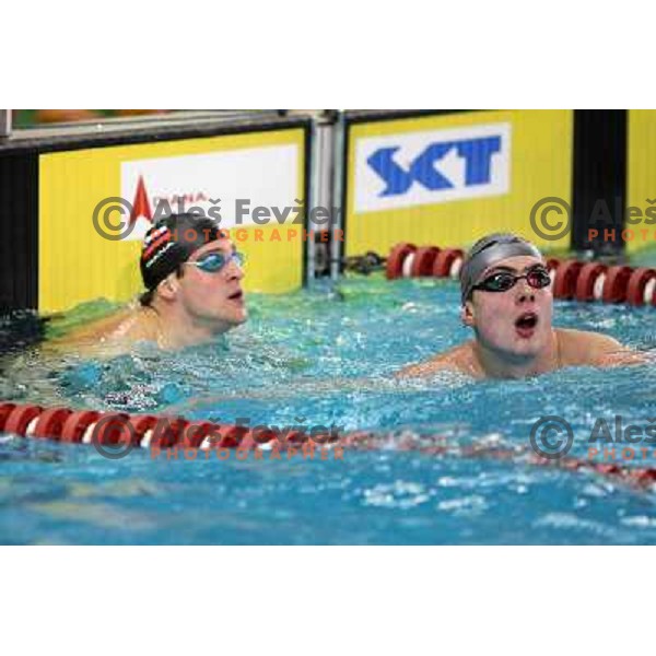 Jernej Godec (SLO) and Sergey Fesikov (RUS) in action during swimming competition Ilirija Challenge in Tivoli pool, Ljubljana, Slovenia 16.12.2009 