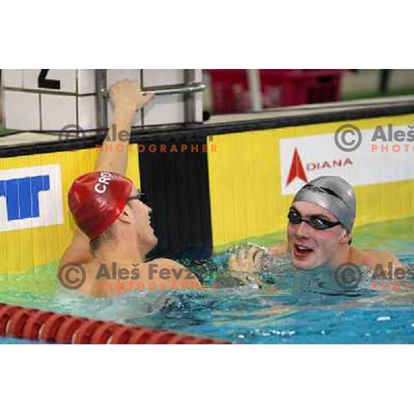 Alexei Puninski (CRO) and Sergey Fesikov (RUS) in action during swimming competition Ilirija Challenge in Tivoli pool, Ljubljana, Slovenia 16.12.2009 