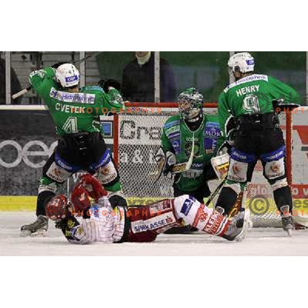 Igor Cvetek,Ales Sila, Harlan Pratt in action during ice-hockey match Tilia Olimpija-KAC in Ebel league, played in Hala Tivoli, Ljubljana, Slovenia 19.1.2010 