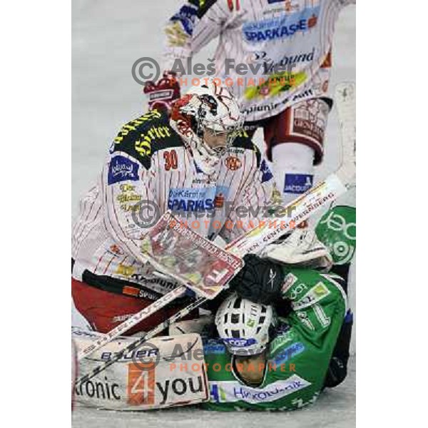 Rene Swetee and Ziga Pance in action during ice-hockey match Tilia Olimpija-KAC in Ebel league, played in Hala Tivoli, Ljubljana, Slovenia 19.1.2010 