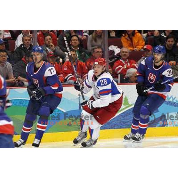 Strbak (77), Semin (28) and Handzus (26) in action during ice-hockey match Russia- Slovakia 18.2.2010 in Preliminary round, Vancouver 2010 Winter Olympic Games, Canada 