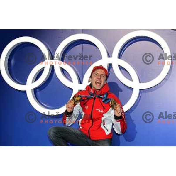 Simon Ammann (SUI) showing two gold medals from ski jumping competition at Normal and Large Hill in Whistler Olympic park during Vancouver 2010 Winter Olympic Games, Canada 