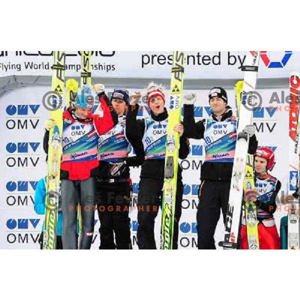 Austria team (winners) at podium at medal ceremony in team world cup ski jumping, 21.3.2010, Planica 