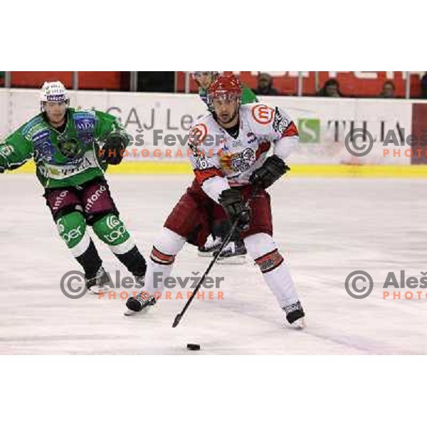 Sebahudin Kovacevic and Ales Music in action during ice-hockey match Tilia Olimpija- Acroni Jesenice in sixth game of Final of Slovenian hockey league, played in Hala Tivoli, Ljubljana, Slovenia 2.4.2010. 