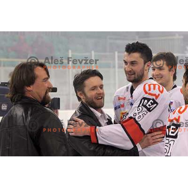 Mike Posma, Dejan Varl and Sabahudin Kovacevic celebrate National ice hockey title after sixth game of Final of Slovenian hockey league between Tilia Olimpija and Acroni Jesenice, played in Hala Tivoli, Ljubljana, Slovenia 2.4.2010. Acroni Jesenice won th