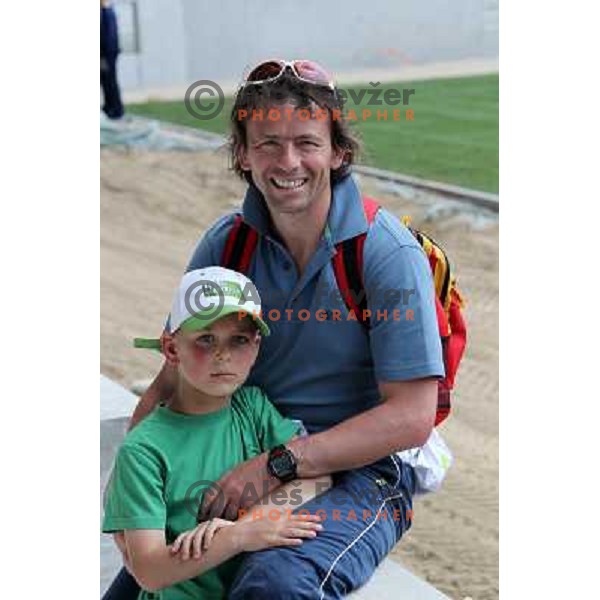 Gregor Zidan with his son Tim watching new turf on the pitch at Stozice football stadium in construction, Ljubljana, Slovenia 1.5.2010 