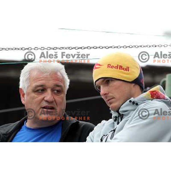 Peter Kauzer Snr. and Peter Kauzer Jr. watching action during ICF kayak&canoe slalom race Tacen 2010 in Ljubljana, Slovenia 15.5.2010 