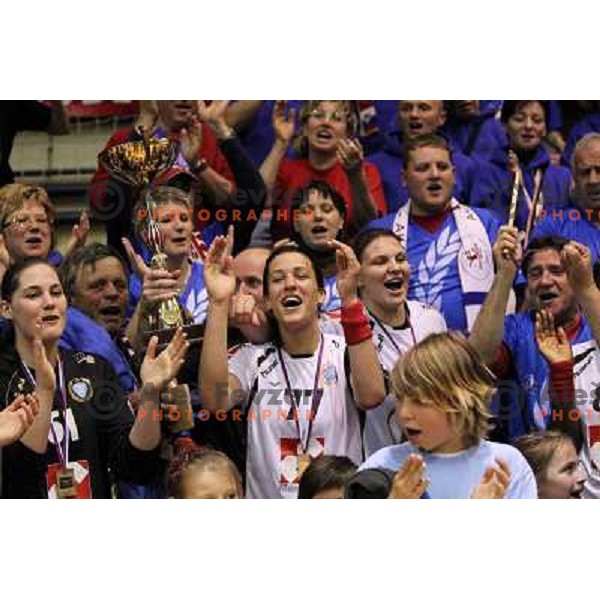 Neja Soberl, Dragana Cvijic, Andrea Lekic, Krim Mercator players and fans celebrate Slovenian national handball title in Ljubljana 15.5.2010 