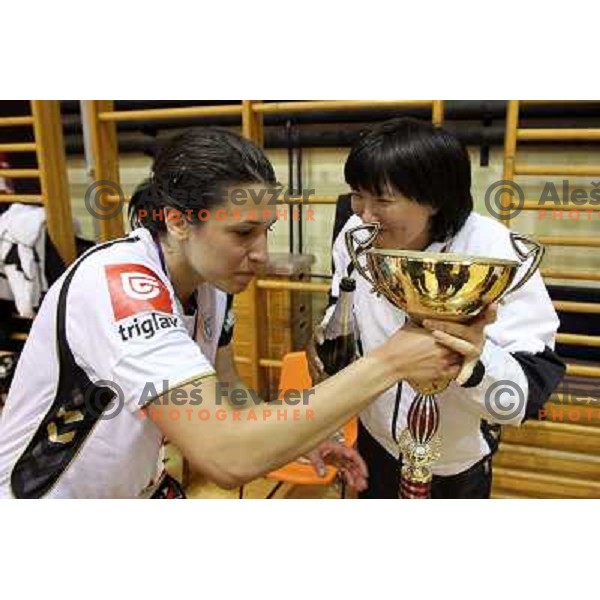 Liudmila Bodnieva , Andrea Lekic with champagne and trophy before Krim Mercator players and fans celebrate Slovenian national handball title in Ljubljana 15.5.2010 