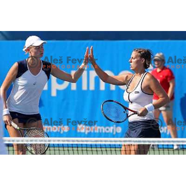 Elena Bovina of Russia and Andreja Klepac of Slovenia in action during the first round of the doubles at WTA Banka Koper Slovenia Open tennis tournament, played in SRC Marina, Portoroz, Slovenia on July 21, 2010 
