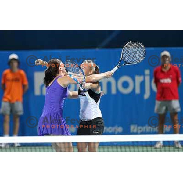 Jelena Jankovic and Aleksandra Krunic of Serbia celebrate victory in second round of the doubles at WTA Banka Koper Slovenia Open tennis tournament, played in SRC Marina, Portoroz, Slovenia on July 21, 2010 