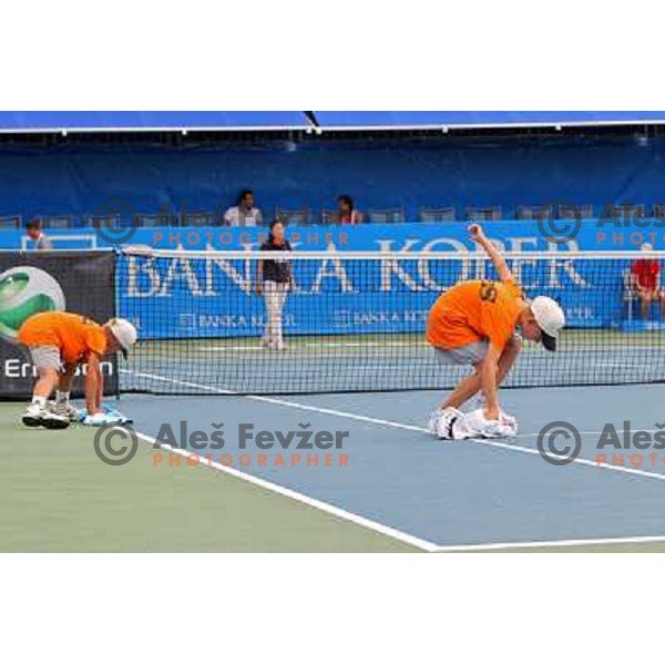 Ball boys wipe the court after rain shower during the quarter-finals of WTA Banka Koper Slovenia Open tennis tournament, played in SRC Marina, Portoroz, Slovenia on July 23, 2010 