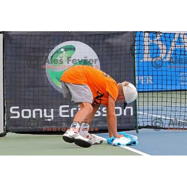 Ball boy wipes the court after rain shower during the quarter-finals of WTA Banka Koper Slovenia Open tennis tournament, played in SRC Marina, Portoroz, Slovenia on July 23, 2010 