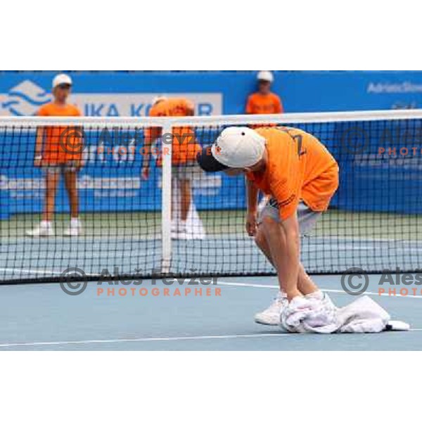 Ball boys wipe the court after rain shower during the quarter-finals of WTA Banka Koper Slovenia Open tennis tournament, played in SRC Marina, Portoroz, Slovenia on July 23, 2010 