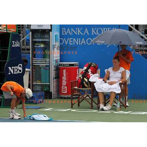 Ball boy wipes the court after rain shower during the quarter-finals of WTA Banka Koper Slovenia Open tennis tournament, played in SRC Marina, Portoroz, Slovenia on July 23, 2010 