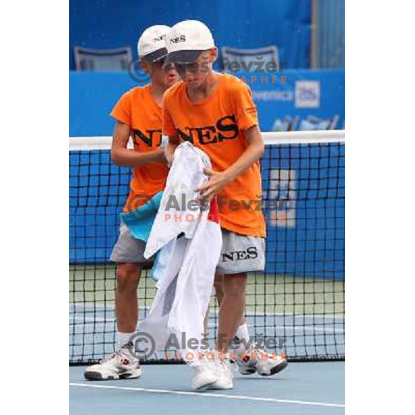 Ball boys wipe the court after rain shower during the quarter-finals of WTA Banka Koper Slovenia Open tennis tournament, played in SRC Marina, Portoroz, Slovenia on July 23, 2010 