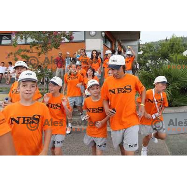 Ball boys raunning before storm hits the Stadium during WTA Banka Koper Slovenia Open tennis tournament, played in SRC Marina, Portoroz, Slovenia on July 24, 2010 