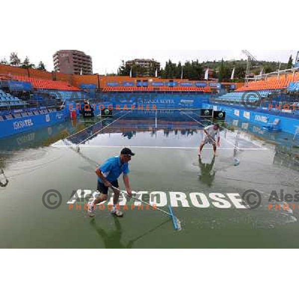 Tournament staff wipe centre court after heavy shower before start of semi-final of WTA Banka Koper Slovenia Open tennis tournament, played in SRC Marina, Portoroz, Slovenia on July 24, 2010 
