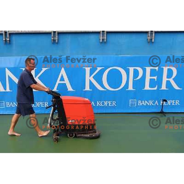 Tournament staff wipe centre court after heavy shower before start of semi-final of WTA Banka Koper Slovenia Open tennis tournament, played in SRC Marina, Portoroz, Slovenia on July 24, 2010 