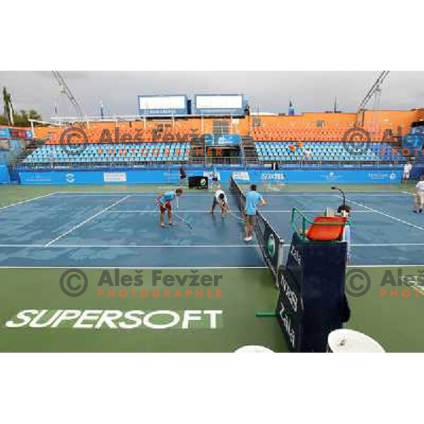 Tournament staff wipe centre court after heavy shower before start of semi-final of WTA Banka Koper Slovenia Open tennis tournament, played in SRC Marina, Portoroz, Slovenia on July 24, 2010 