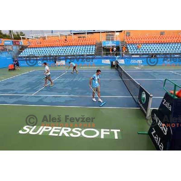 Tournament staff wipe centre court after heavy shower before start of semi-final of WTA Banka Koper Slovenia Open tennis tournament, played in SRC Marina, Portoroz, Slovenia on July 24, 2010 