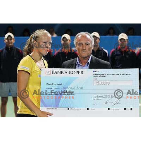 Enzo Savai gives a cheque to Johanna Larsson of Sweden ,runner-up at WTA Banka Koper Slovenia Open tennis tournament, played in SRC Marina, Portoroz, Slovenia on July 25, 2010 