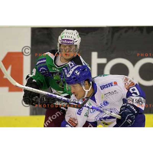 Jure Stopar, Marko Lovrencic in action during ice-hockey match Tilia Olimpija-KHL Medvescak in round 3 of EBEL league, played in Hala Tivoli, Ljubljana, Slovenia on September 17, 2010 