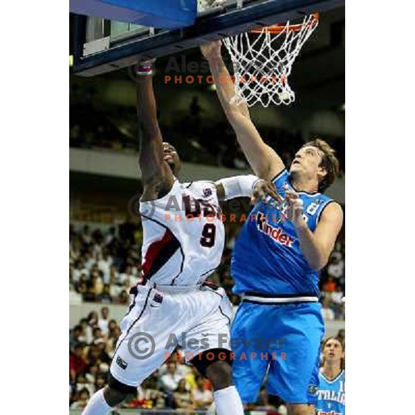 Denis Marconato tries to stop Dwyane Wade