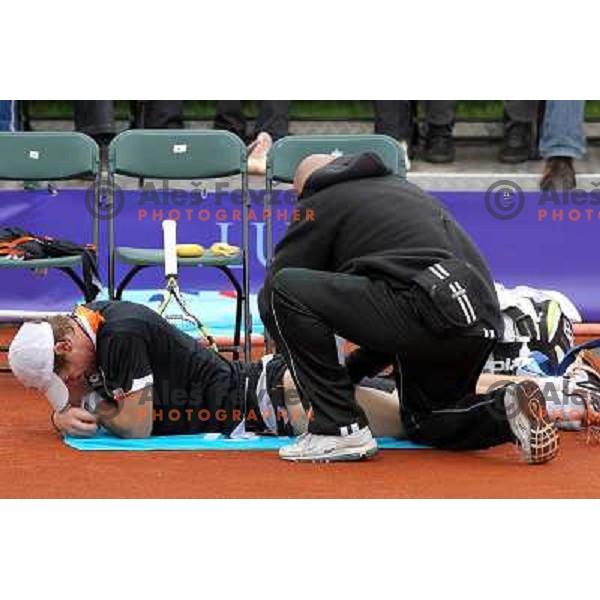 Blaz Kavcic of Slovenia gets medical treatment during Final of BMW Ljubljana Open, ATP Challenger Tour, played in SC Ljubljana on September 26, 2010 