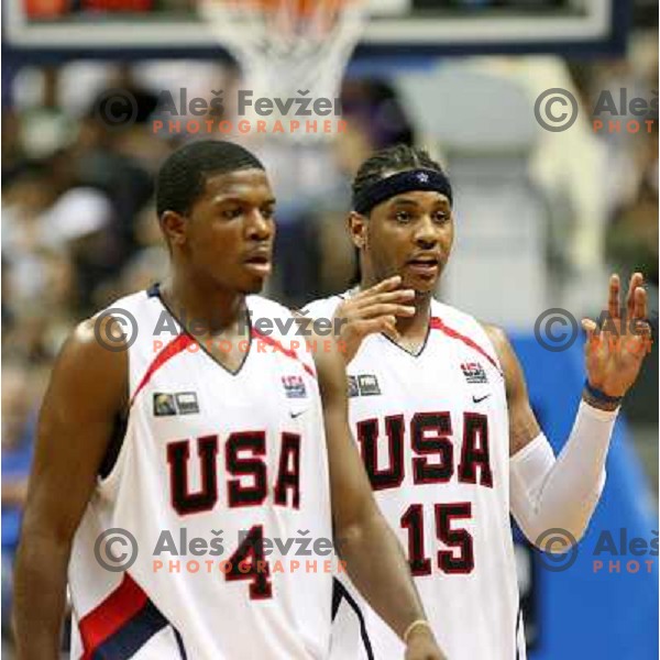 Joe Johnson and Carmelo Anthony leaving the court for time-out