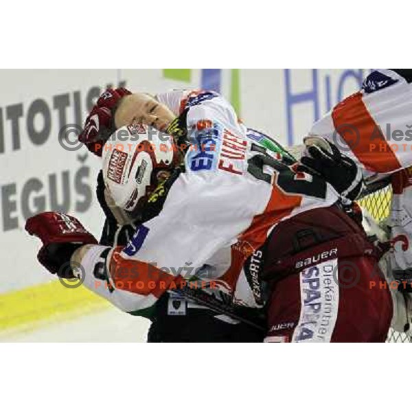 Andrej Hebar of Tilia Olimpija and Furey of KAC in action during ice-hckey match Tilia Olimpija-KAC in round 12 of EBEL league, played in Hala Tivoli,Ljubljana on October 17,2010 