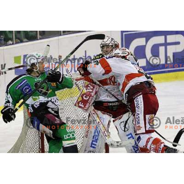 Andrej Hebar of Tilia Olimpija and Furey of KAC in action during ice-hckey match Tilia Olimpija-KAC in round 12 of EBEL league, played in Hala Tivoli,Ljubljana on October 17,2010 
