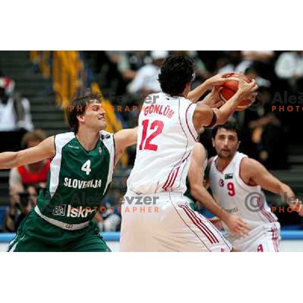 Goran Jurak tries to stop Kerem Gonlum, Sorkan Erdogan (9) watches