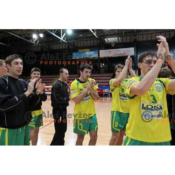 Darko Cingesar and players of RD Loka celebrate victory during handball match RD Slovan-RD Loka in round 15 of 1.SLR, played at Kodeljevo Hall, Ljubljana, Slovenia on December 18, 2010 