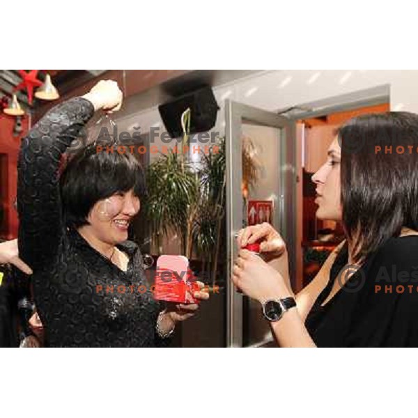 Liudmila Bodnieva and Andrea Lekic, Players of handball club Krim Mercator during New Year\'s party in Bachus Center, Ljubljana, Slovenia on December 30,2010 