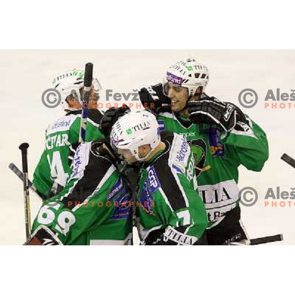Hocevar, Ziga Pance, Pintaric, Vedlin of Tilia Olimpija celebrate victory during ice-hockey match Tilia Olimpija-Vienna Capitals in round 36 of EBEL league, played in Hala Tivoli, Ljubljana on January 7, 2011 