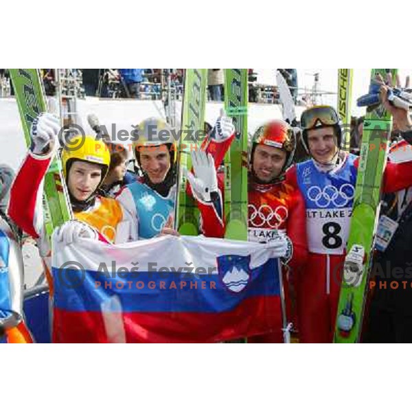 Robert Kranjec, Primoz Peterka, Damjan Fras, Peter Zonta of Slovenia with bronze olympic medal at team ski- jumping competition in Winter Olympic games in Salt Lake City, USA on February 2002 