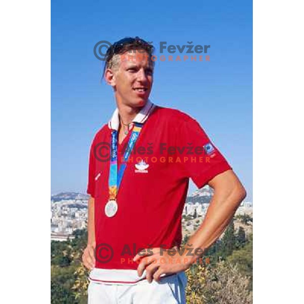 Luka Spik of Slovenia, silver medalist in rowing at Summer Olympic Games in Athens, Greece , August 2004 pictured in front of Acropolis 